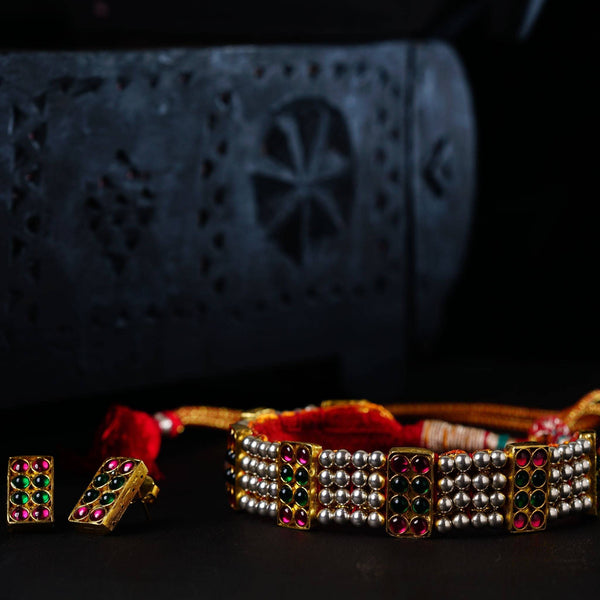 a couple of bracelets sitting on top of a table