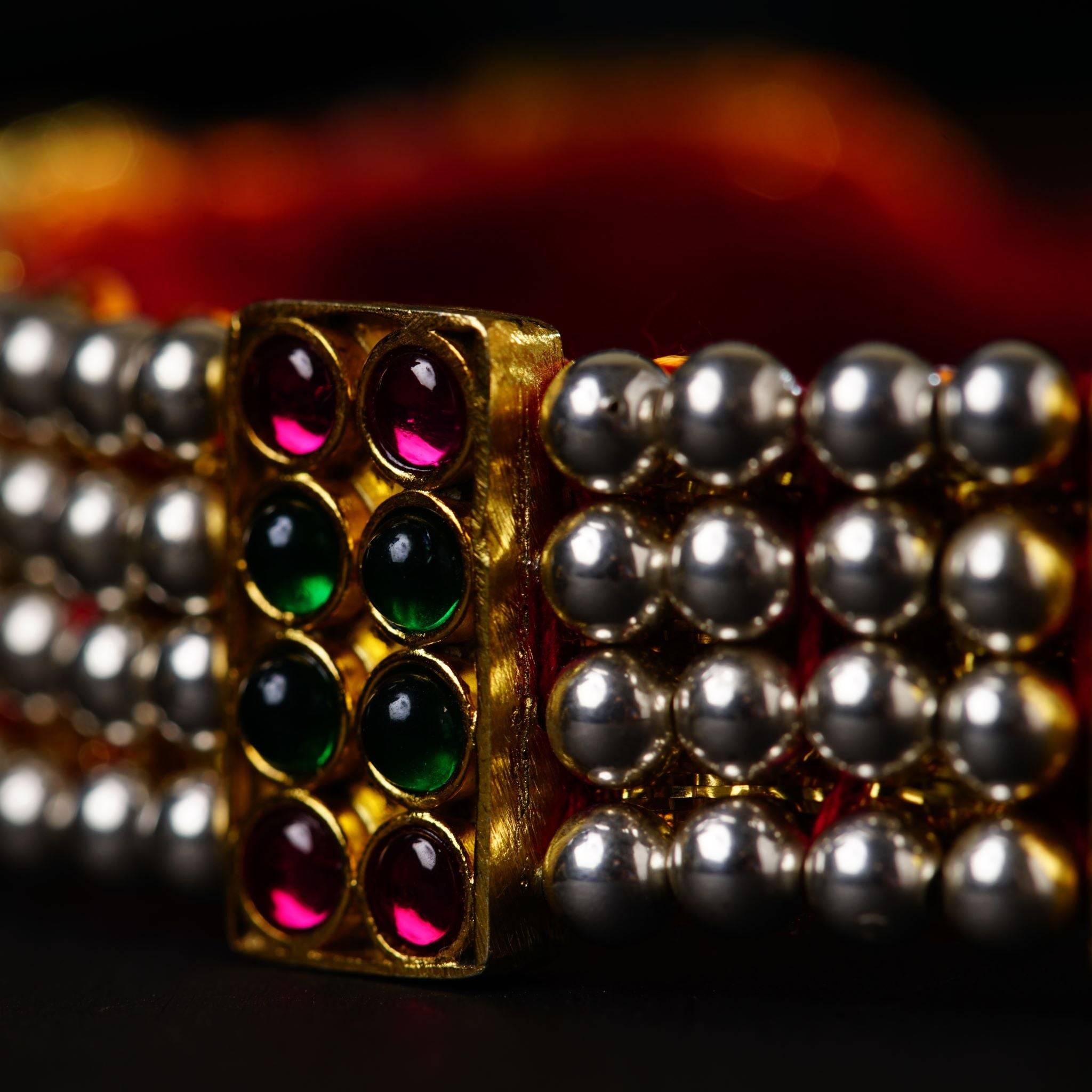 a close up of two bracelets on a table