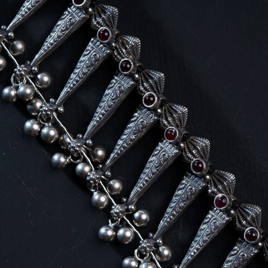 a close up of a bracelet with a bunch of beads