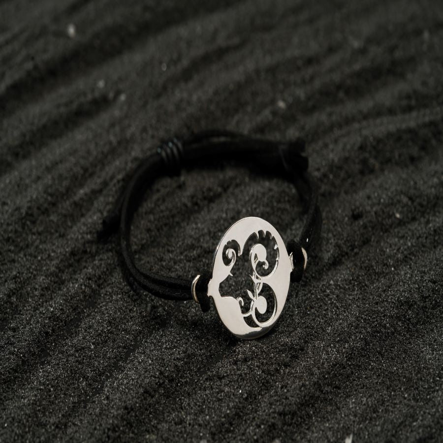 a black and white photo of a bracelet
