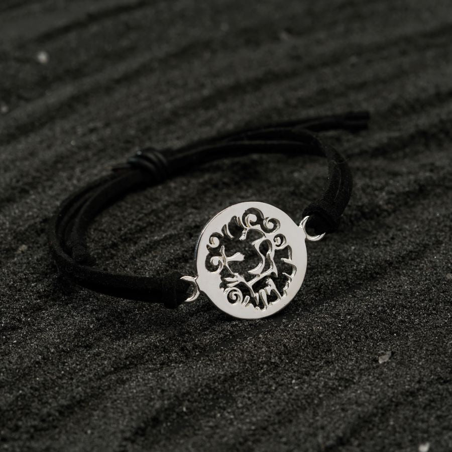 a black and white photo of a bracelet