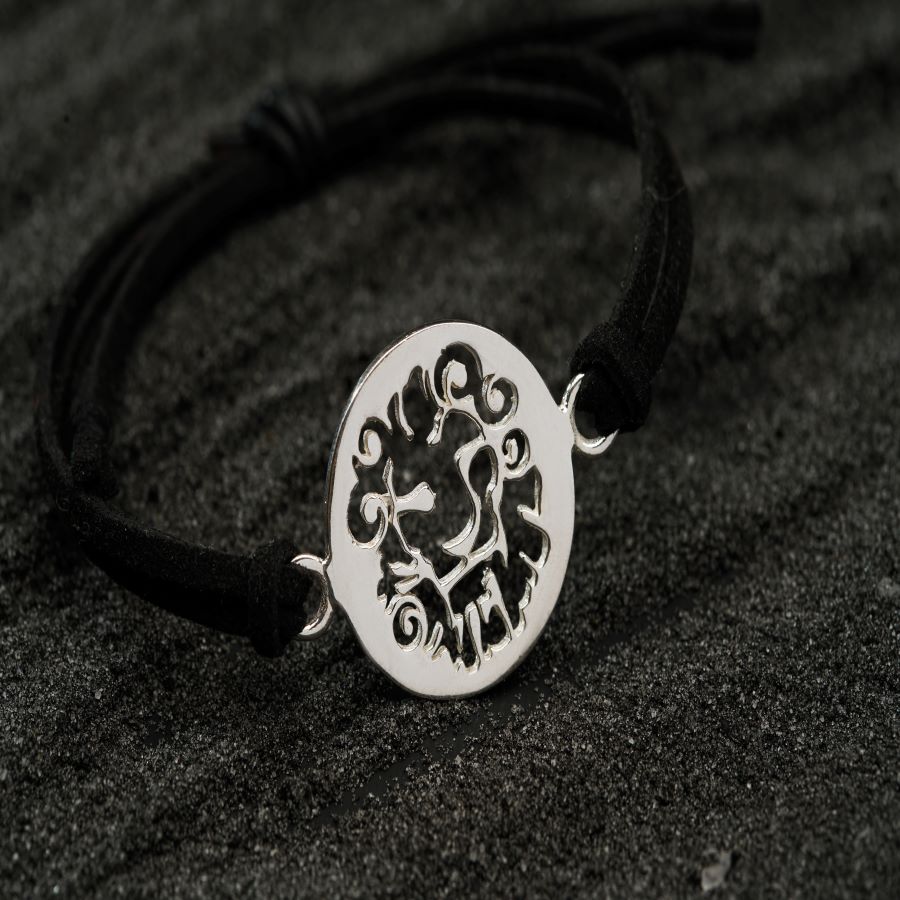 a black and white photo of a bracelet