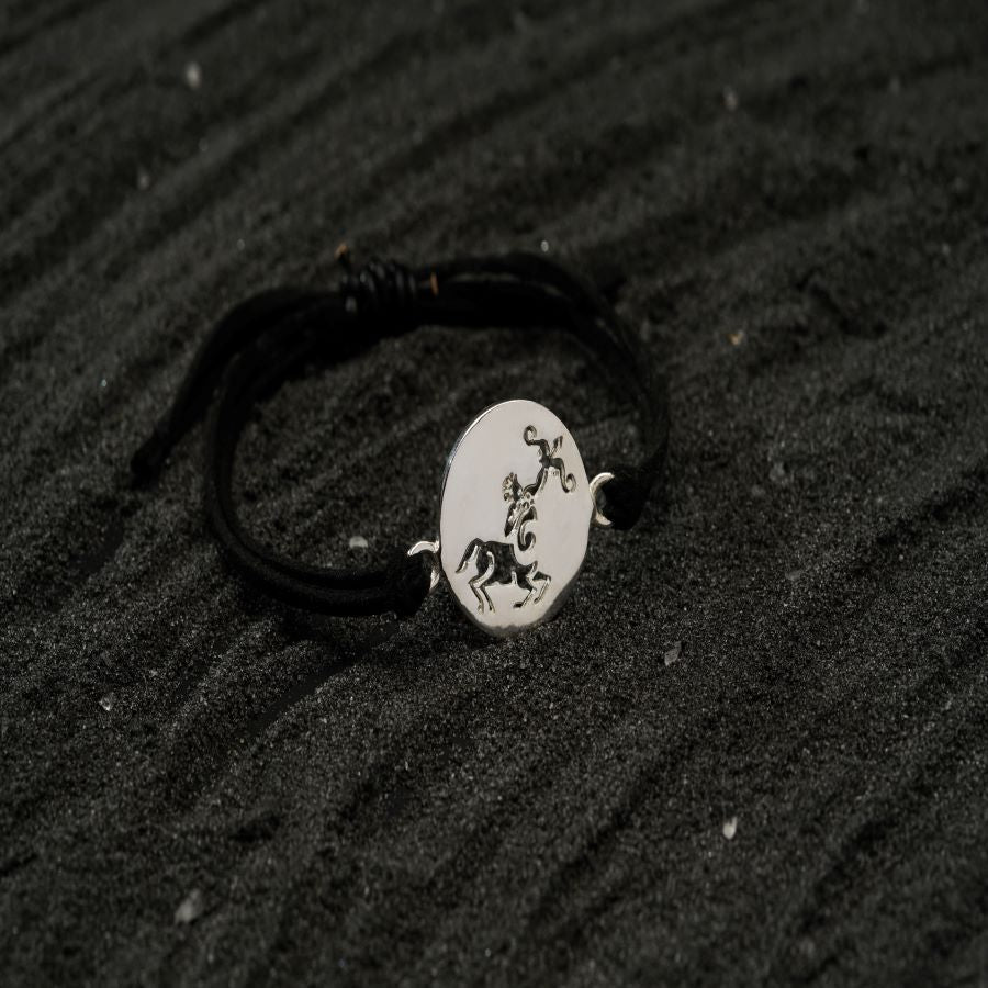 a bracelet with a picture of a horse on it