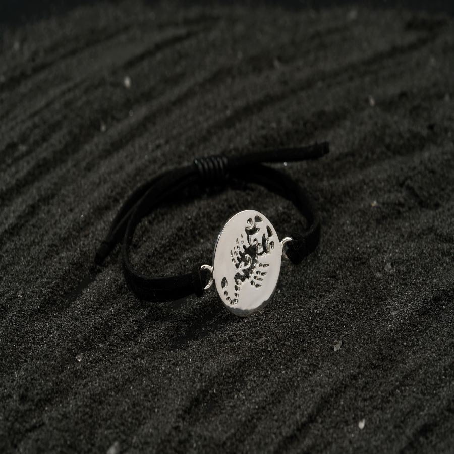 a black and white photo of a bracelet