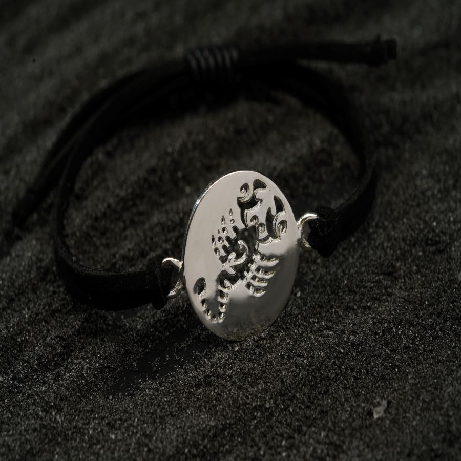 a black and white photo of a bracelet