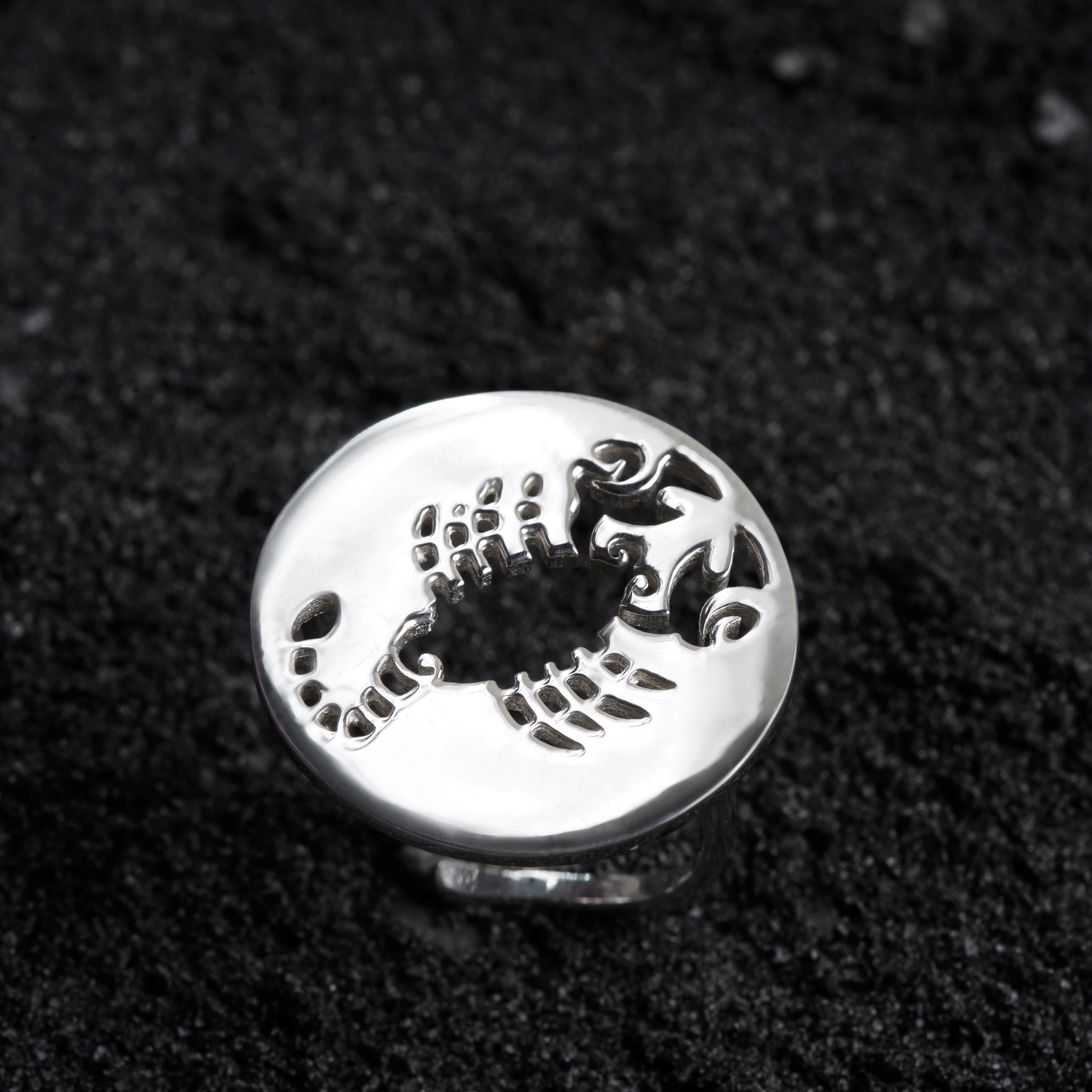 a silver ring with a scorpion on it