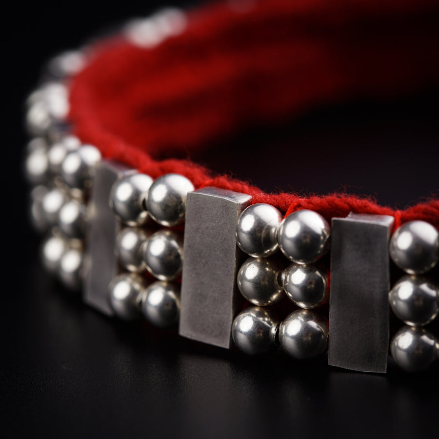 a close up of a bracelet on a table