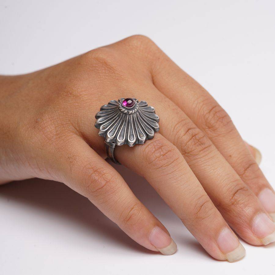 a woman's hand with a ring on it