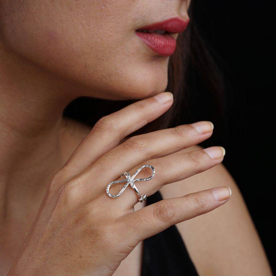 a close up of a person wearing a ring