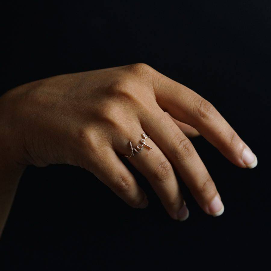 a woman's hand with a ring on it