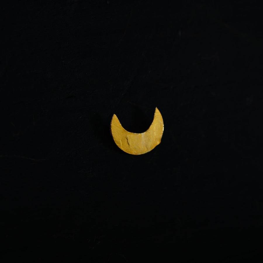 a yellow crescent on a black background