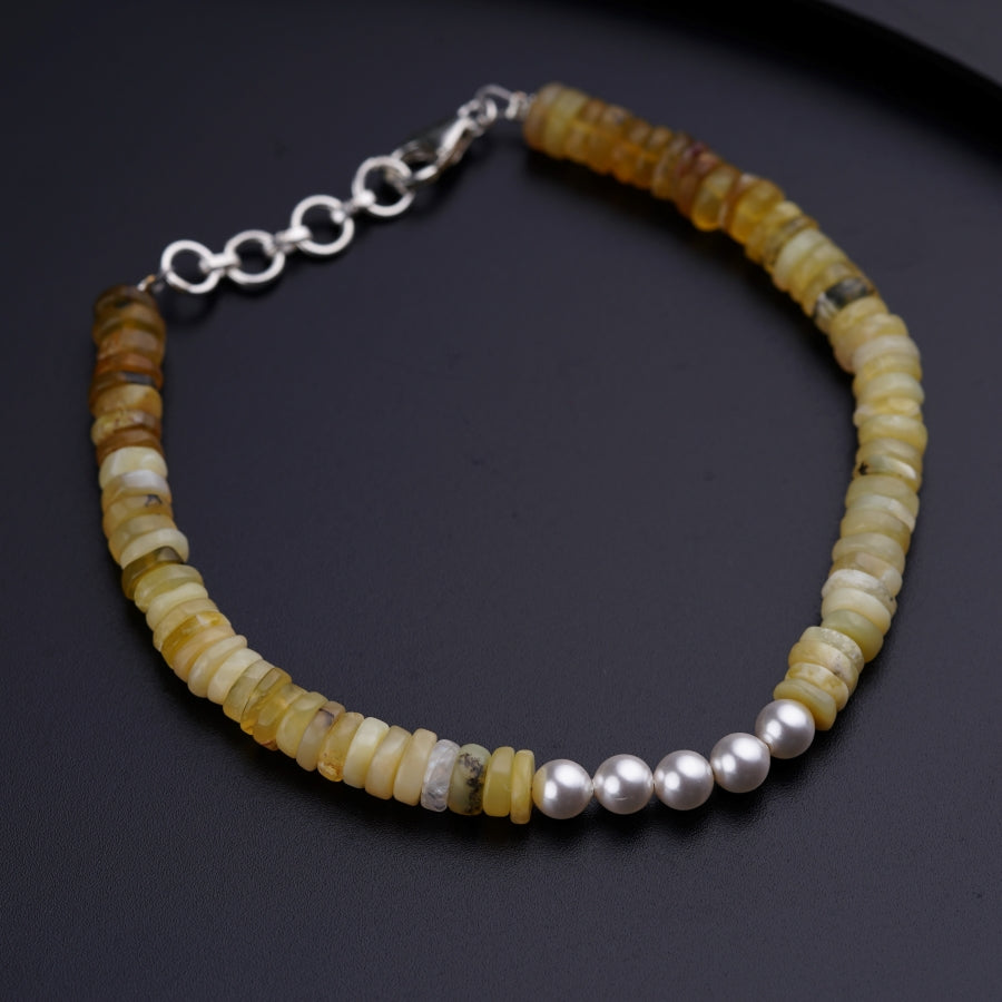 a close up of a bracelet on a table