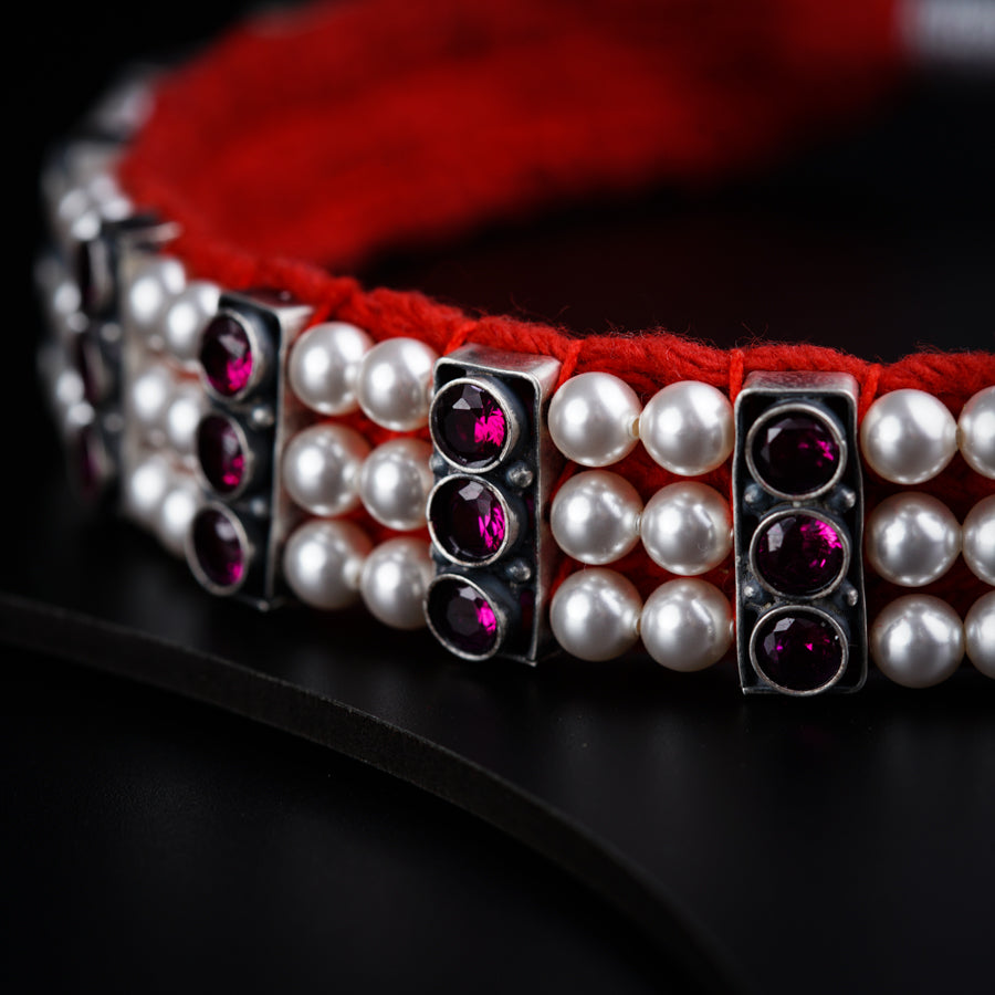 a close up of a bracelet on a table