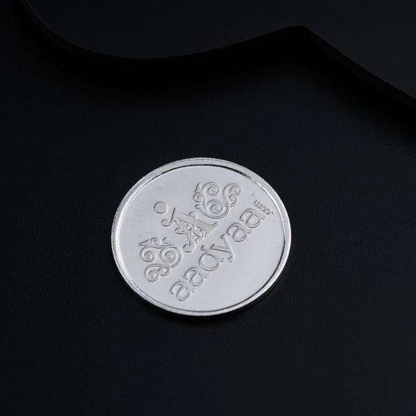 a close up of a coin on a black surface