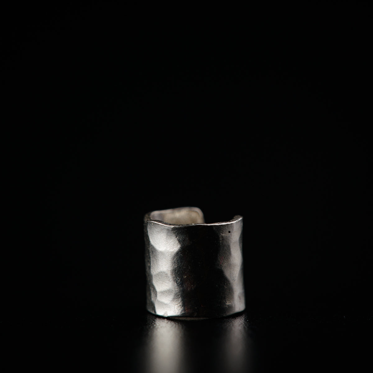 a silver ring sitting on top of a table