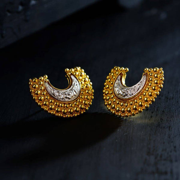 a pair of gold and diamond earrings
