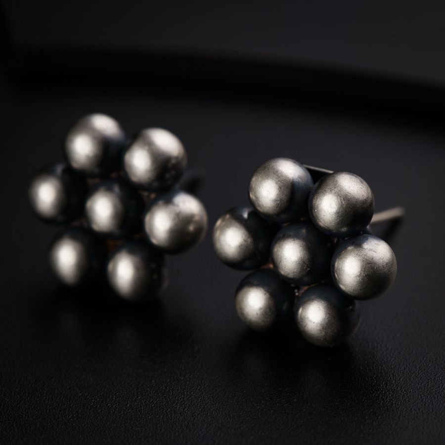 a pair of silver balls sitting on top of a table