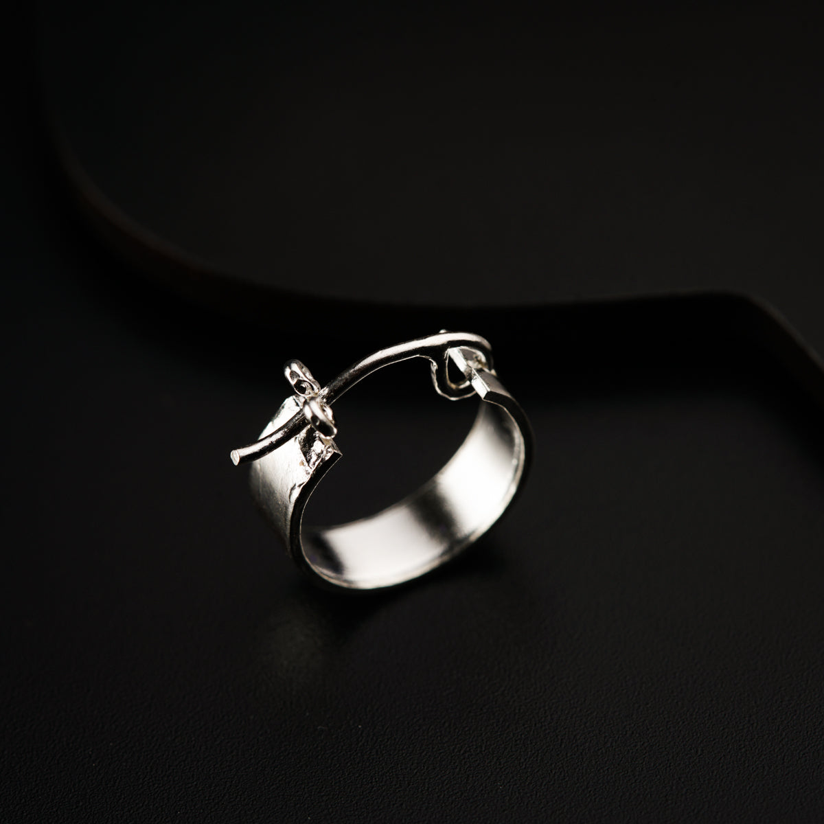 a close up of a ring on a black surface