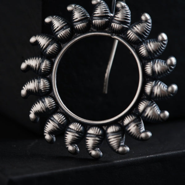 a metal object with a circular design on it