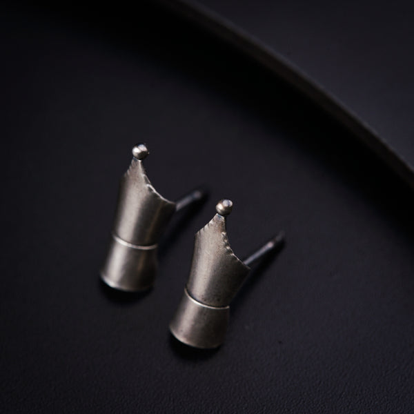 a couple of metal pieces sitting on top of a table