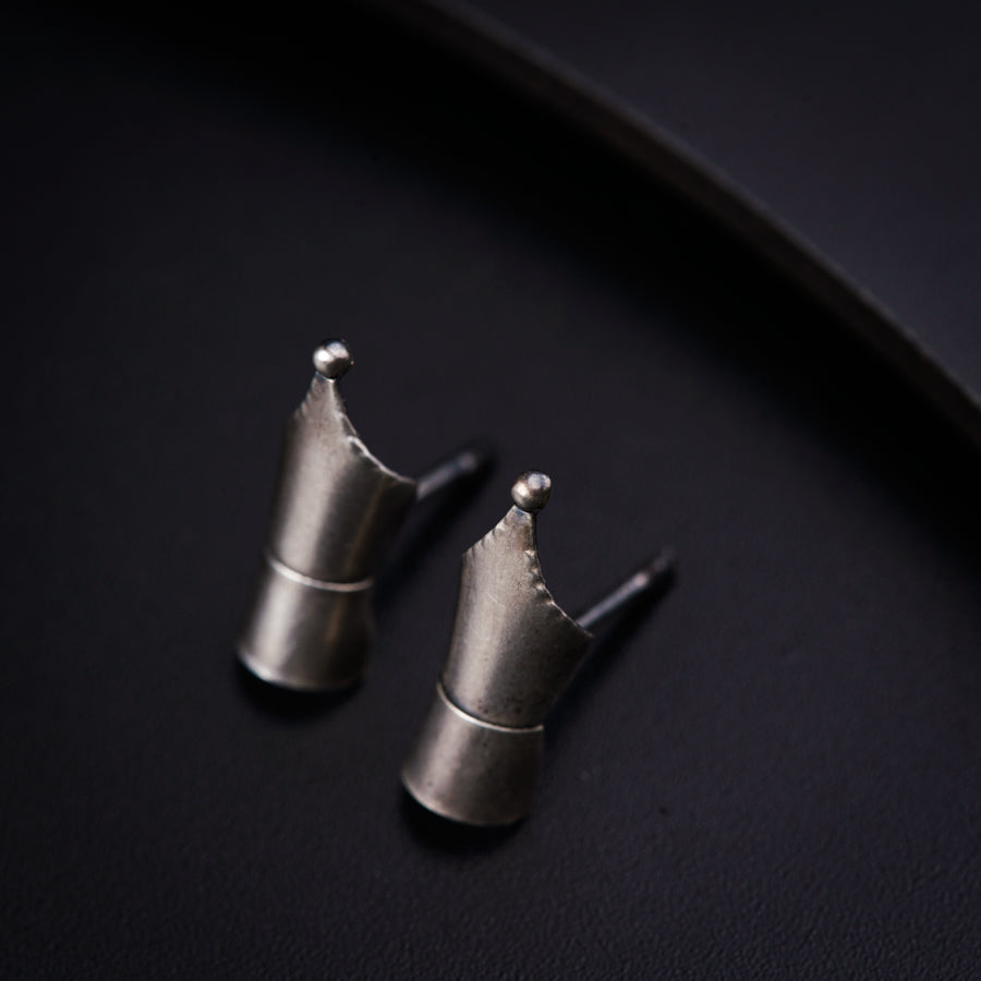 a couple of metal pieces sitting on top of a table