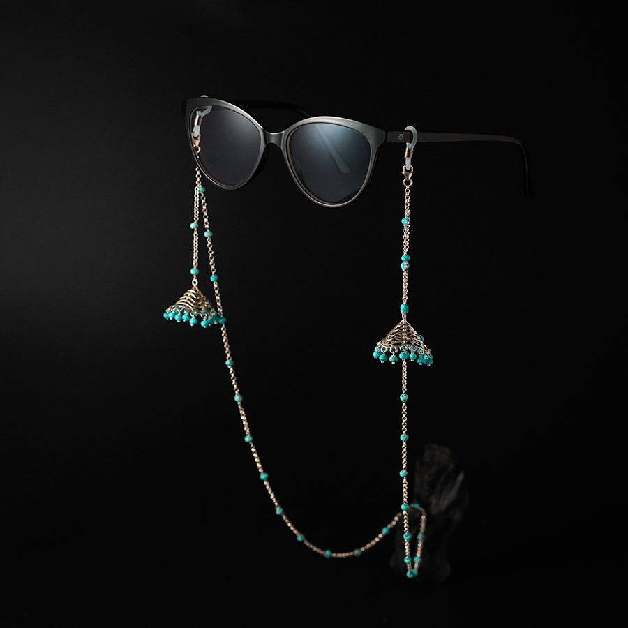 a pair of sunglasses hanging from a chain
