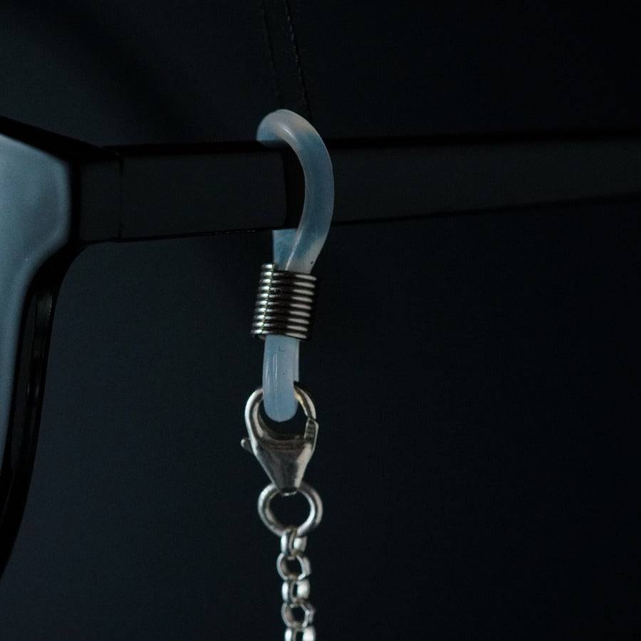 a pair of glasses hanging from a hook