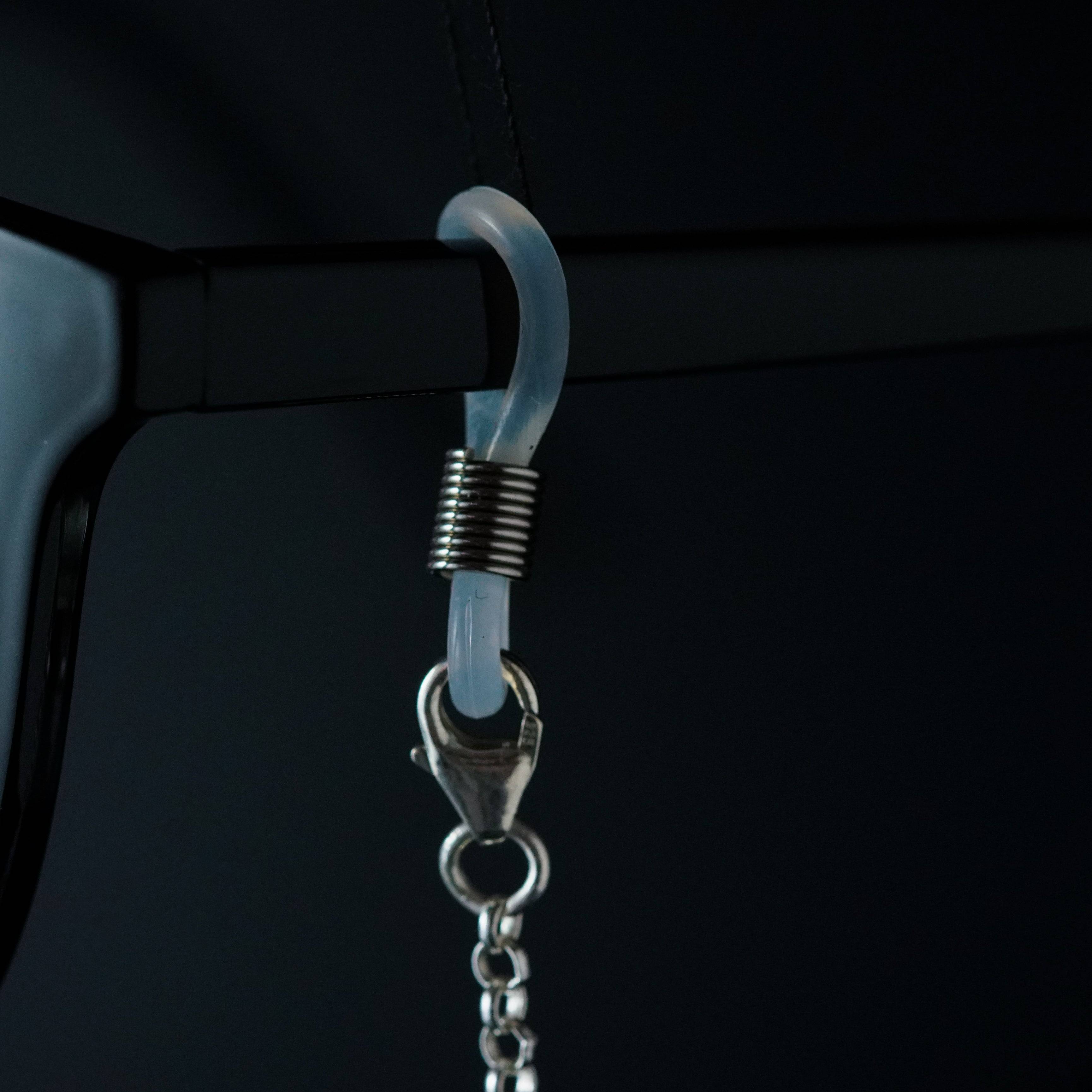a pair of glasses hanging from a hook