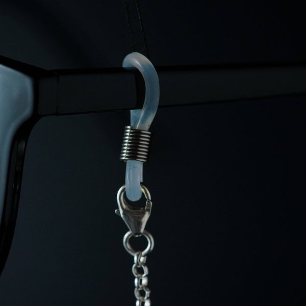 a pair of glasses hanging from a hook