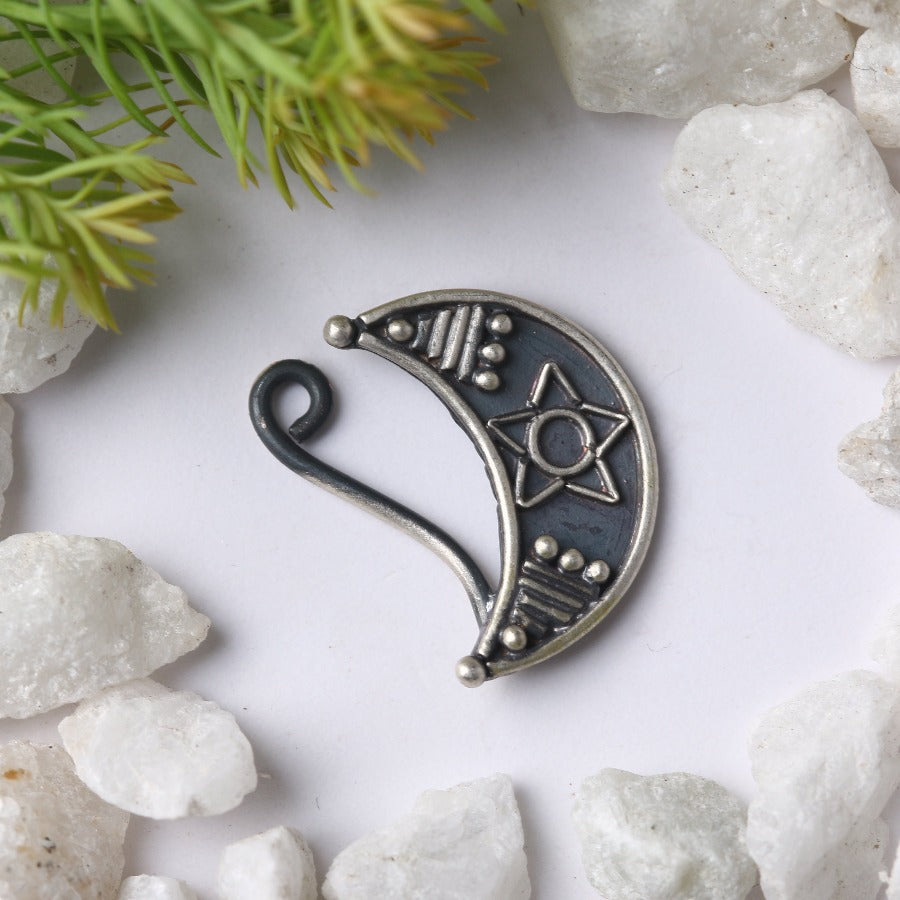 a metal hook with a design on it