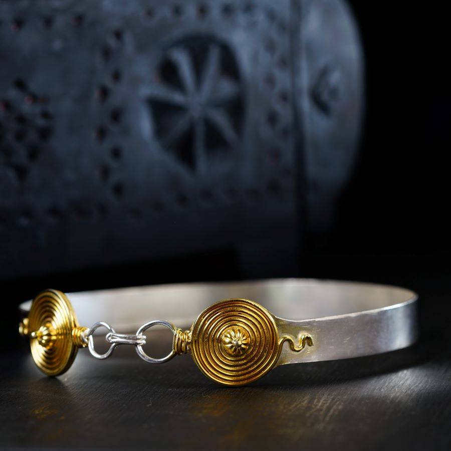 a close up of a bracelet on a table