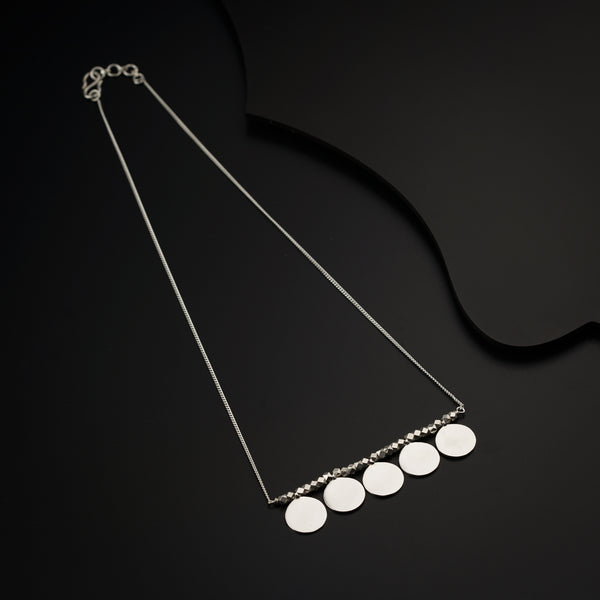 a necklace with five discs hanging from it