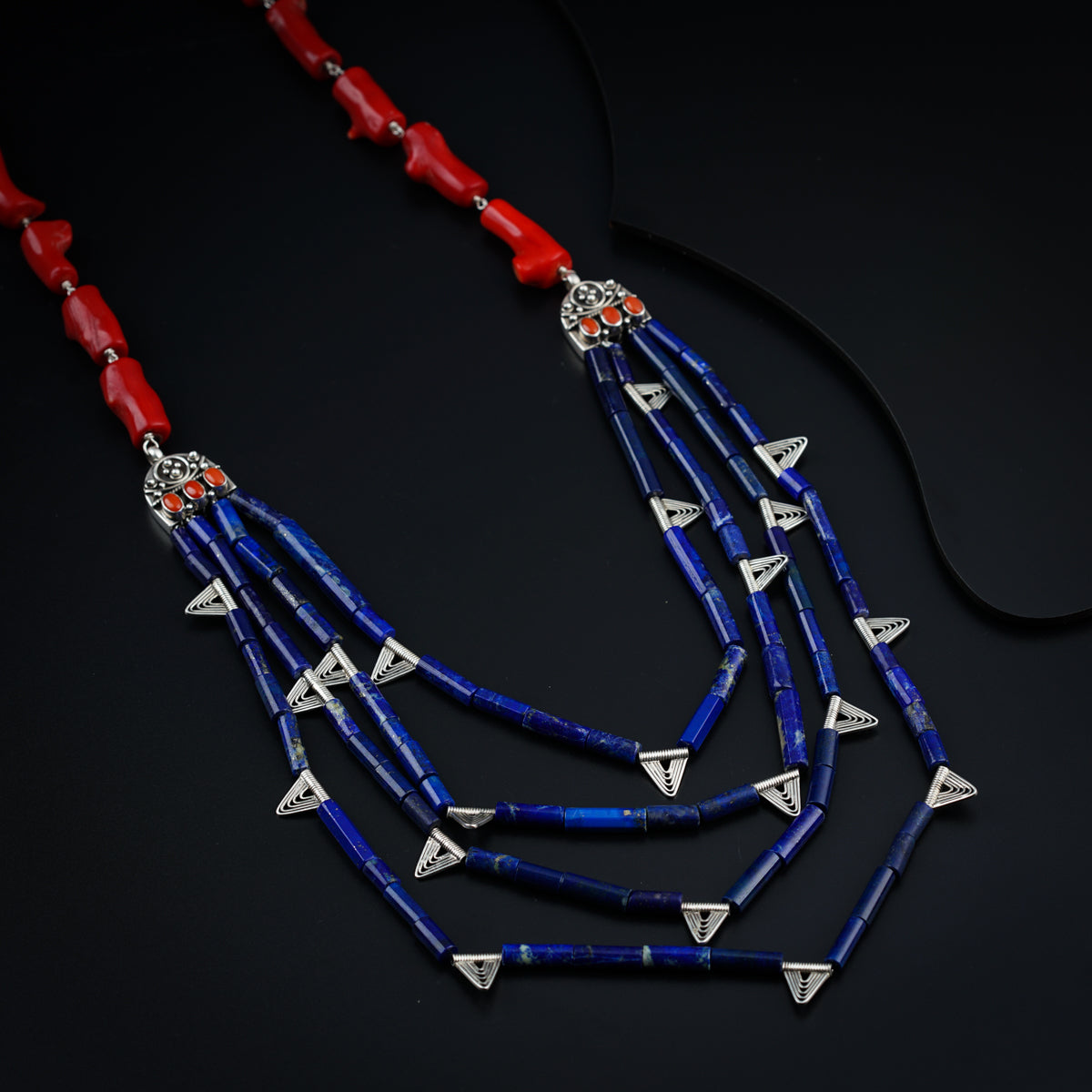 a necklace with red, white and blue beads