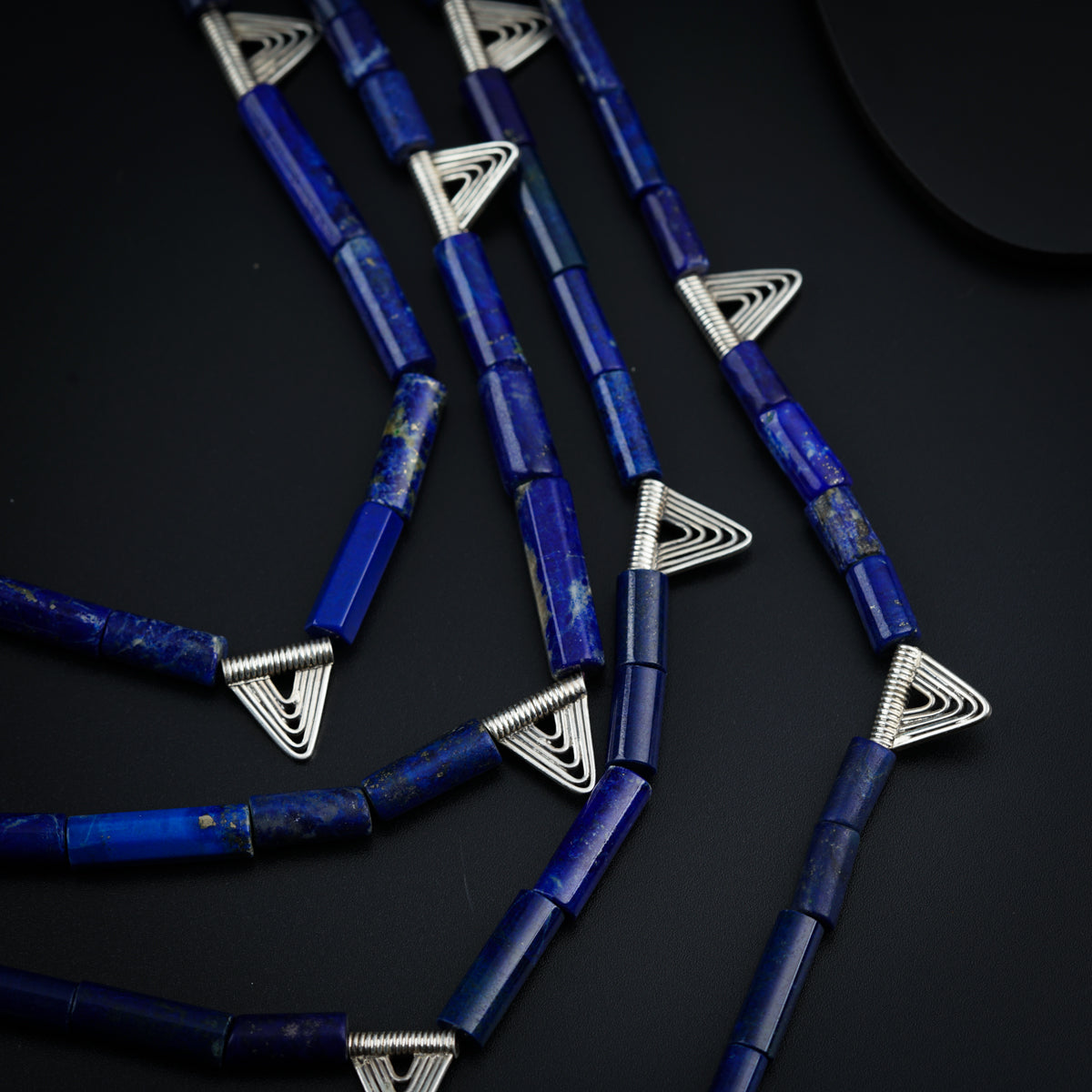 a group of blue pens sitting on top of a table