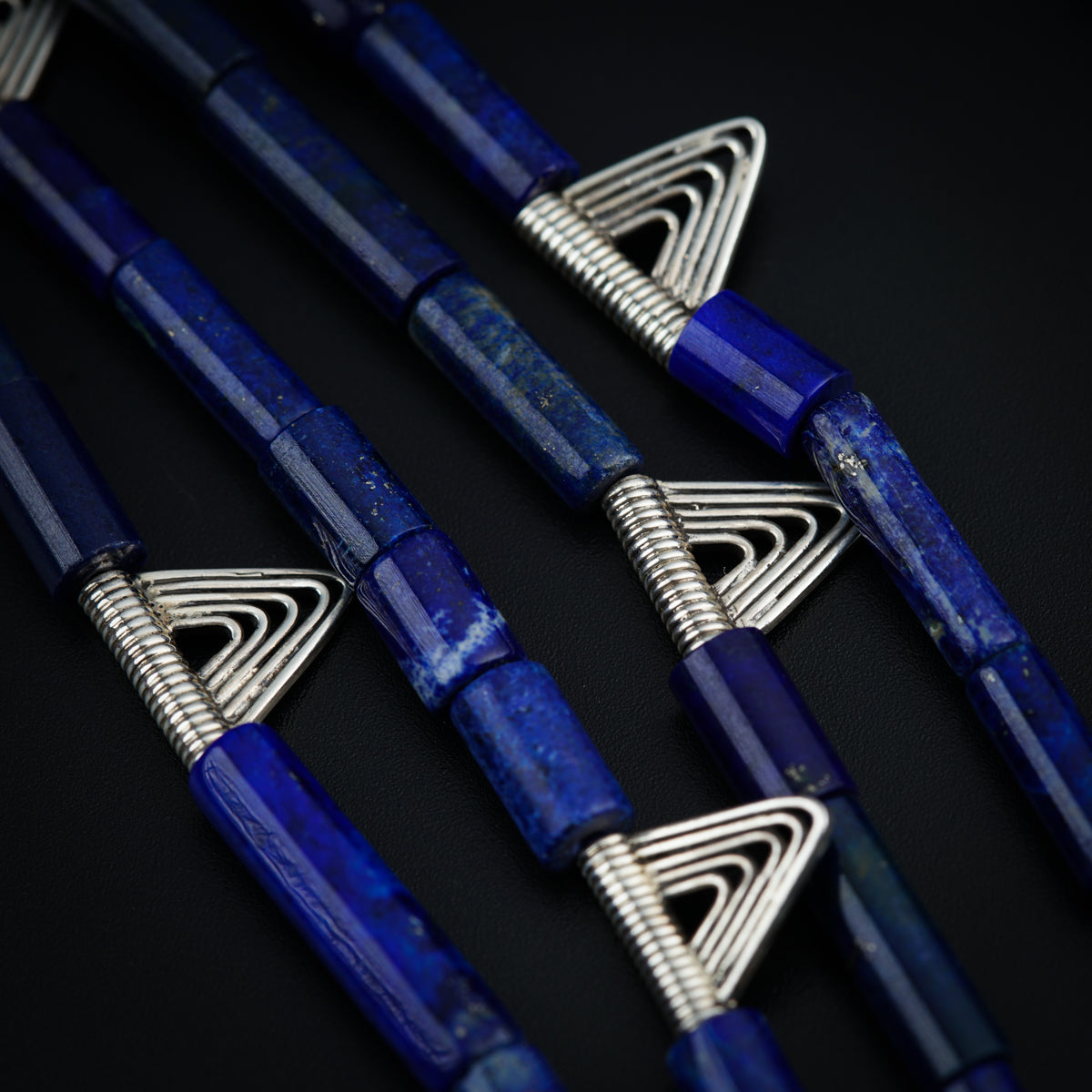 a group of blue pens sitting on top of a table