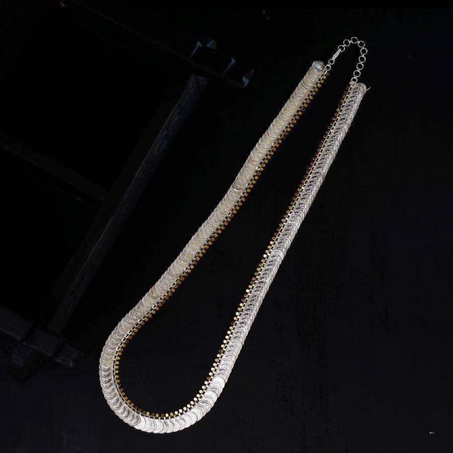 a long silver chain hanging from a ceiling
