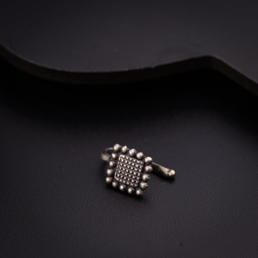 a close up of a ring on a black surface