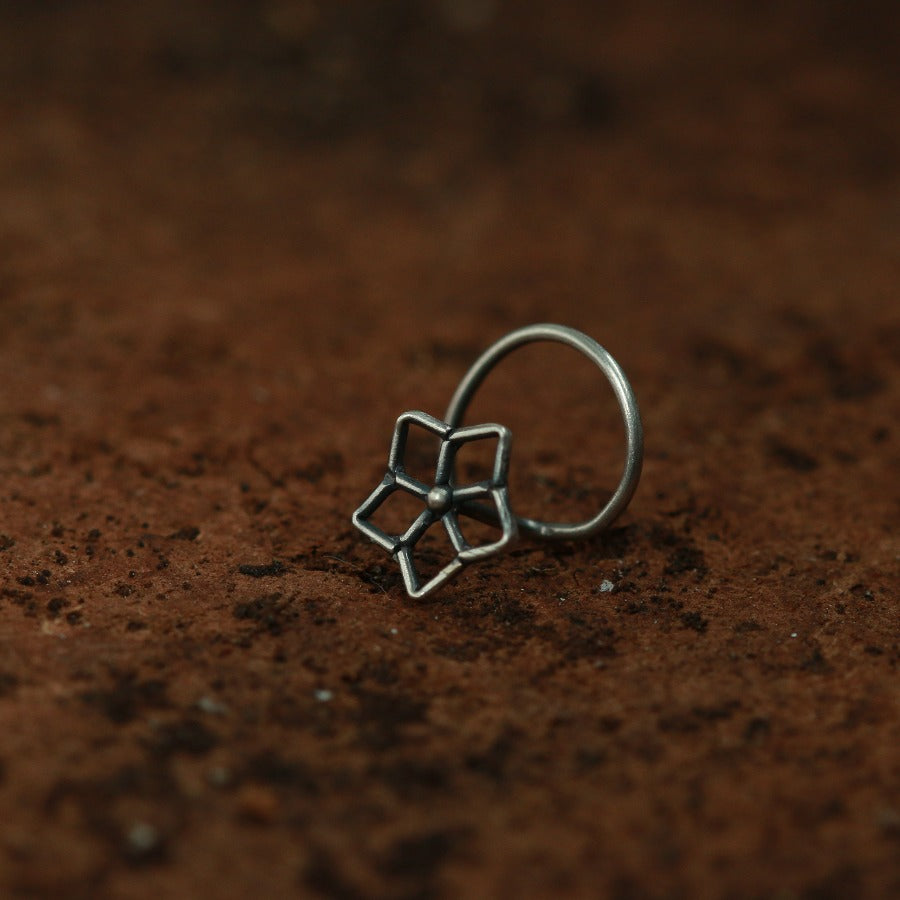 a close up of a ring on a brown surface