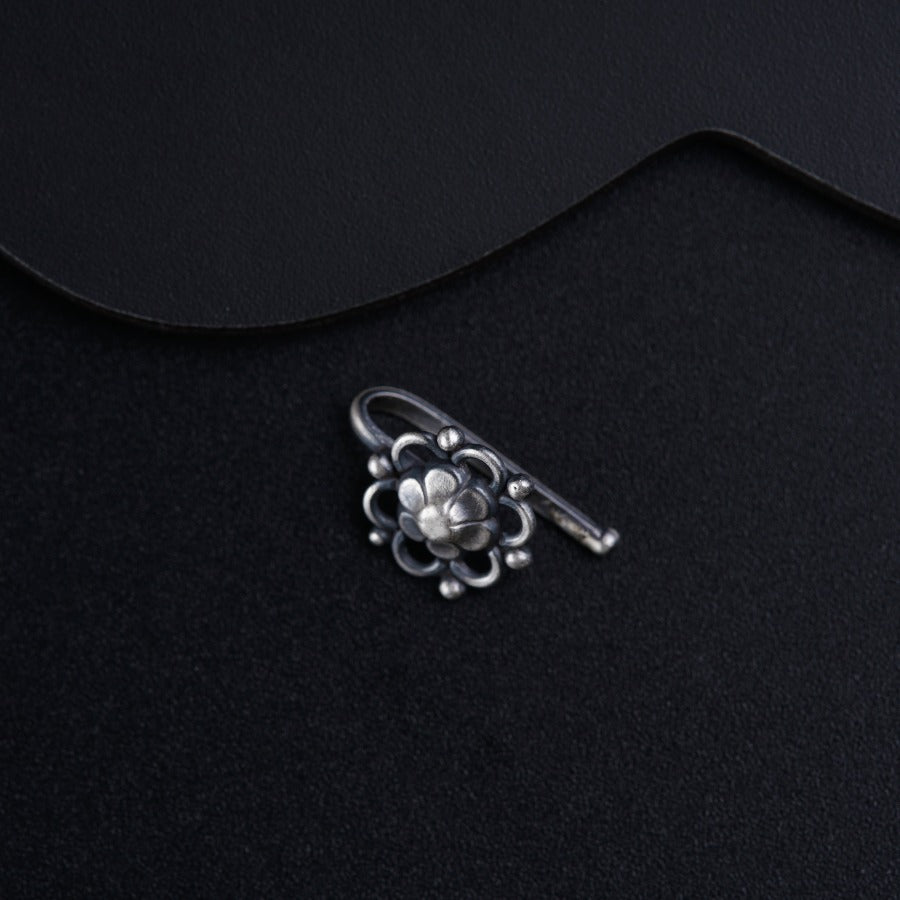 a pair of scissors sitting on top of a black surface