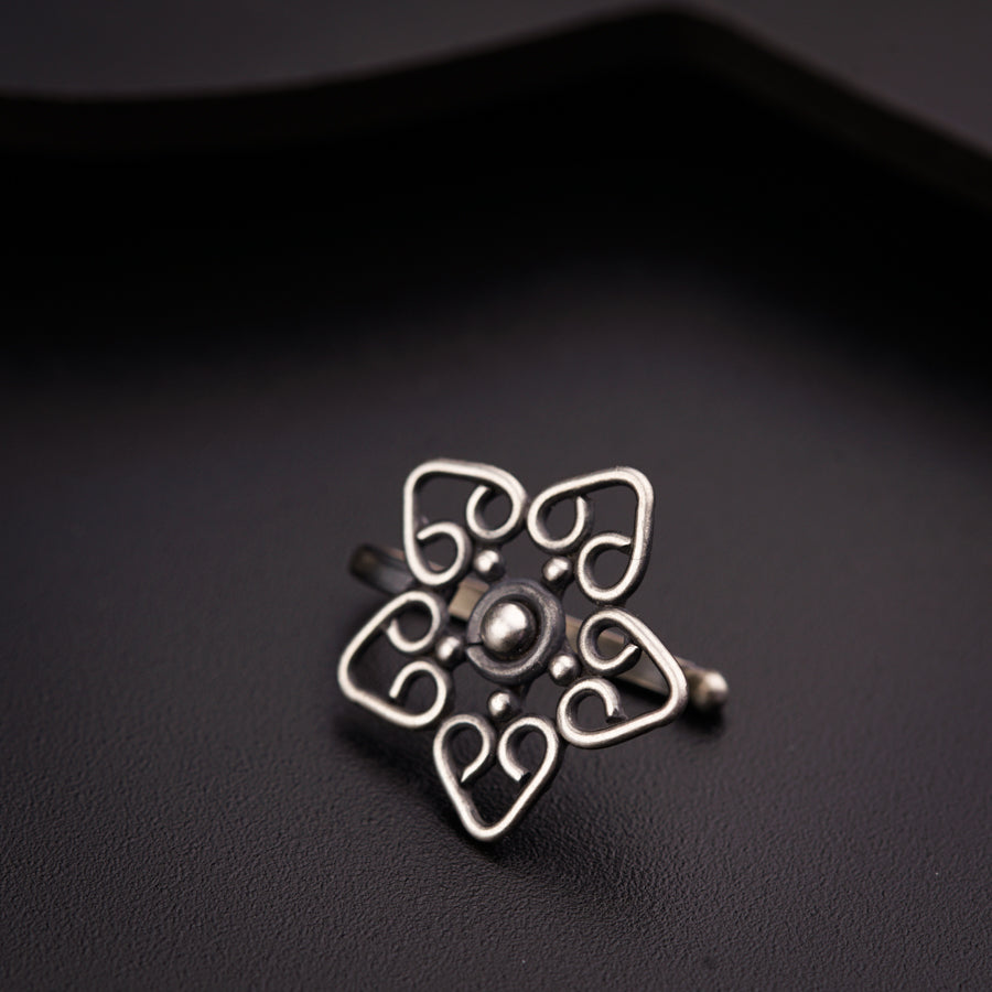 a close up of a ring on a black surface