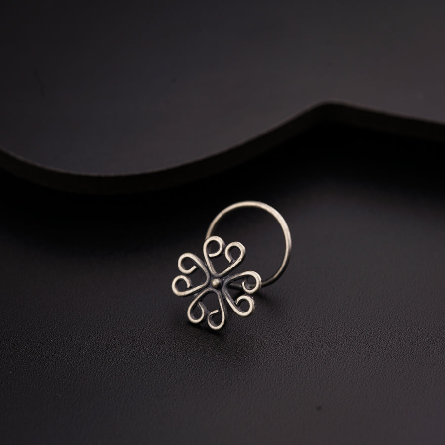 a close up of a ring on a black surface