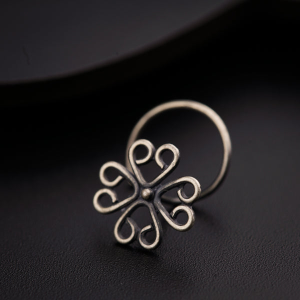 a close up of a ring on a black surface