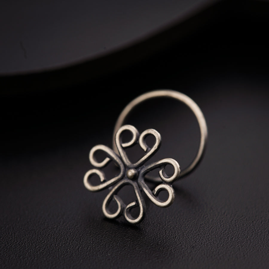 a close up of a ring on a black surface