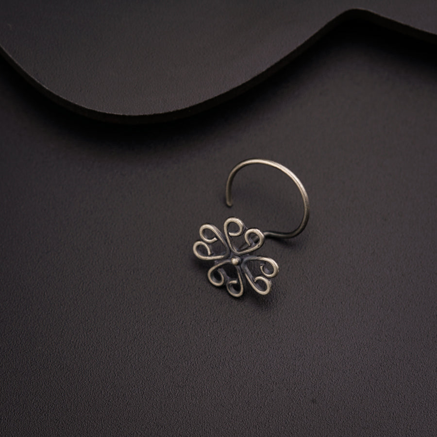 a close up of a ring on a black surface