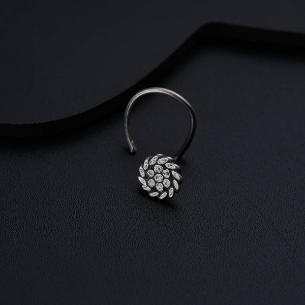 a close up of a ring on a black surface