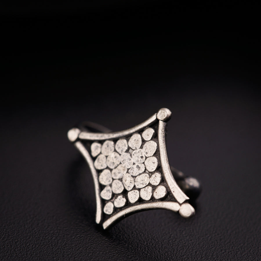 a close up of a ring on a black surface