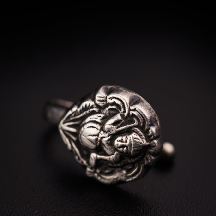 a close up of a ring on a black surface
