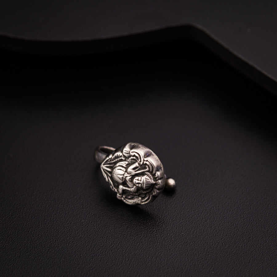 a close up of a ring on a black surface