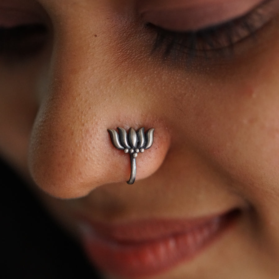 a close up of a person with a nose piercing