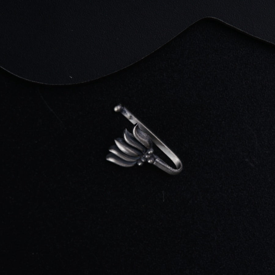 a ring that is sitting on a black surface